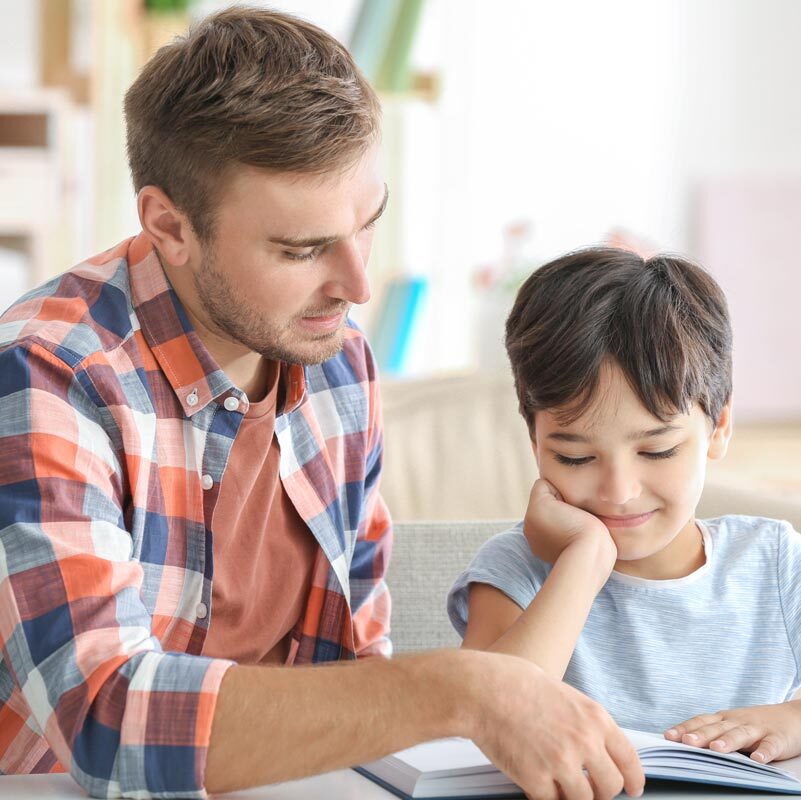 Parent reading to child.